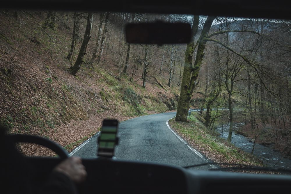 View of inside car empty road in countryside