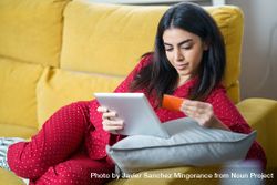 Woman shopping at home on tablet with credit card 41xlg5