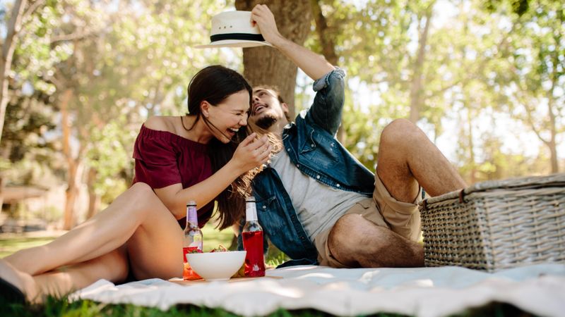 Couple enjoying on picnic at park