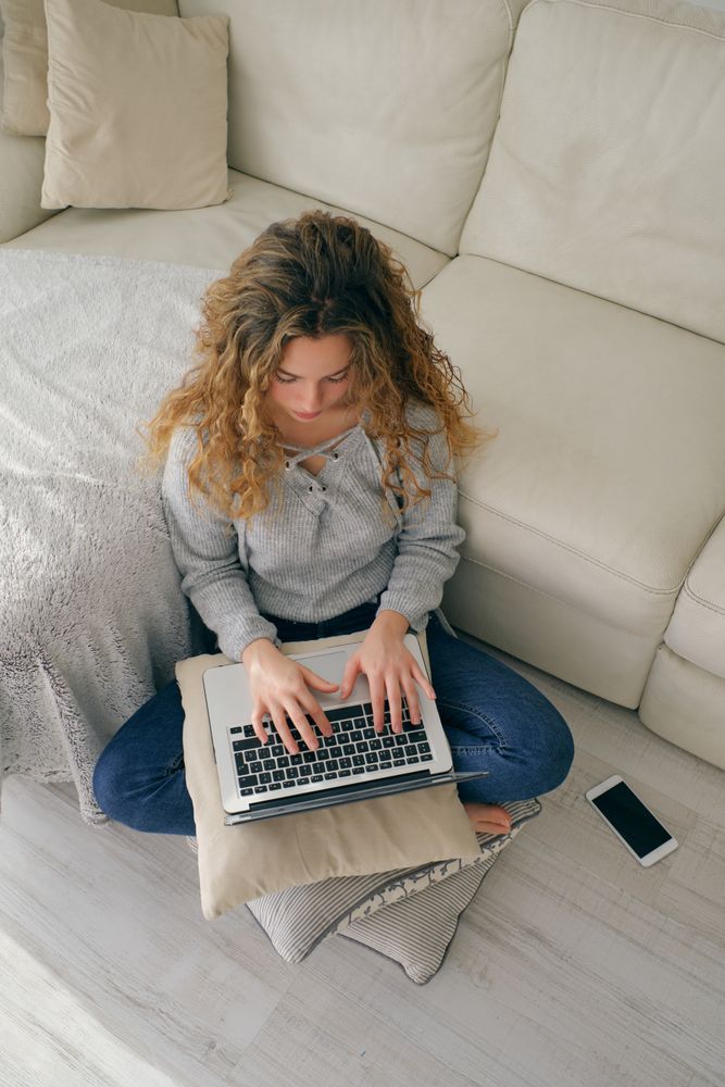 Young woman using laptop at home