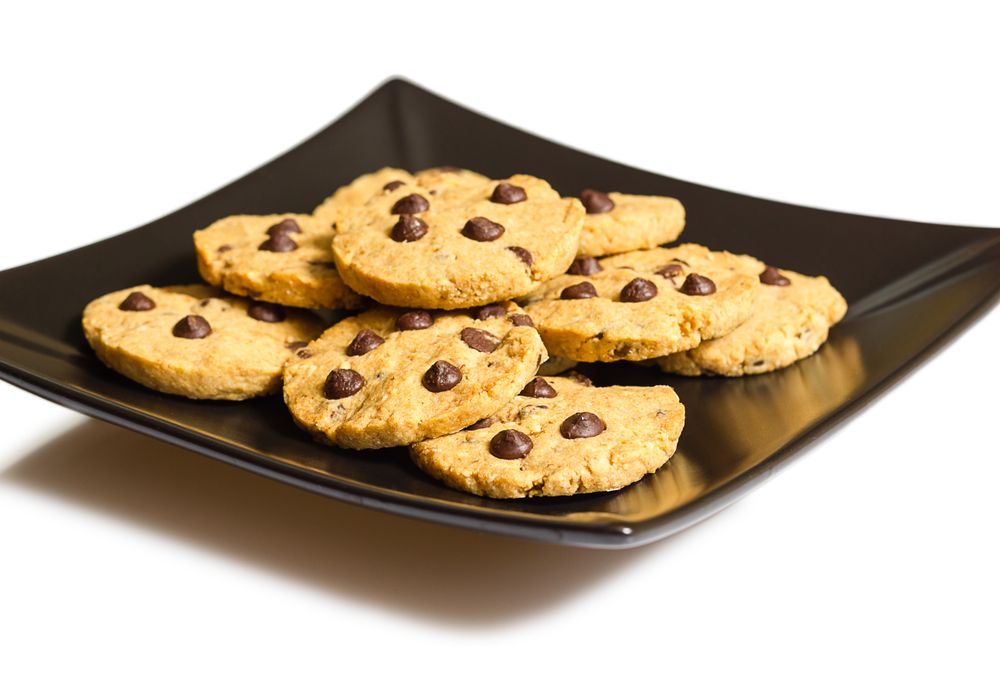 Chocolate chip cookies on a plate isolated on light background