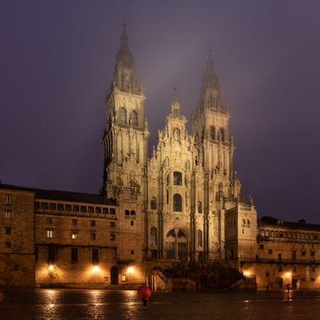 Santiago de Compostela Cathedral view at misty foggy night after rain. Cathedral of Saint James pilgrimage. Galicia, Spain