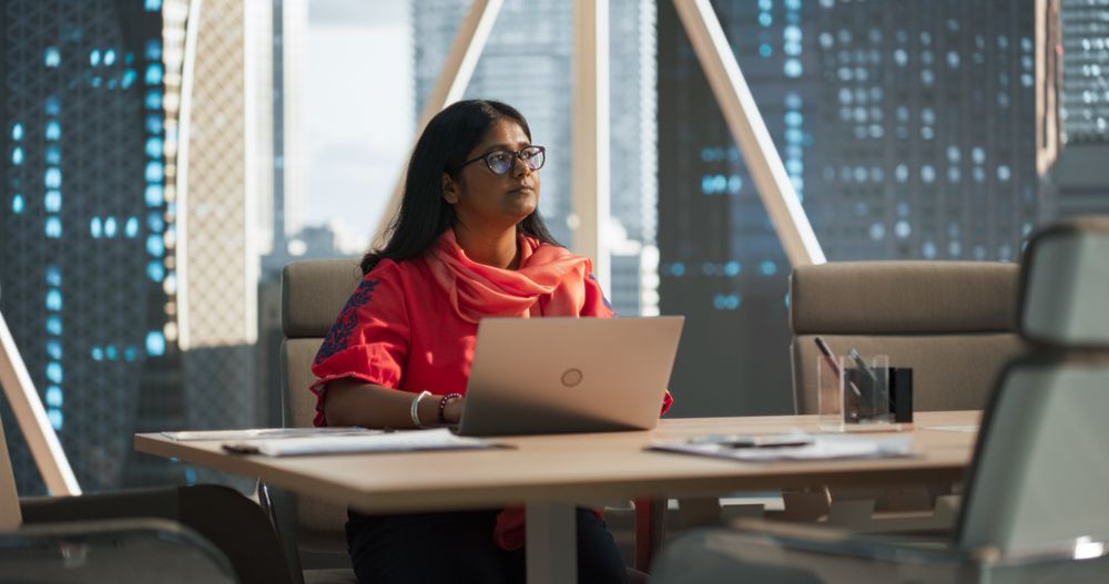 Empowering Portrait of an Indian Businesswoman Working on Laptop Computer in a Fintech Startup Company.