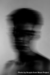Grayscale blurry portrait of topless young man bY7D95