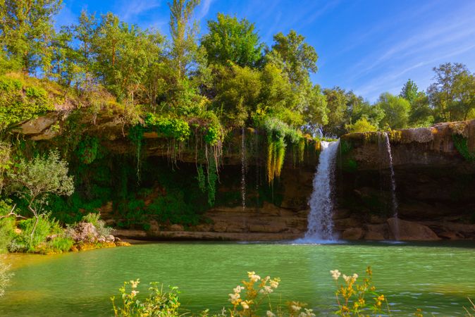 View of beautiful waterfall and lake