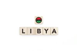 Wooden blocks bearing the name and flag of Libya.