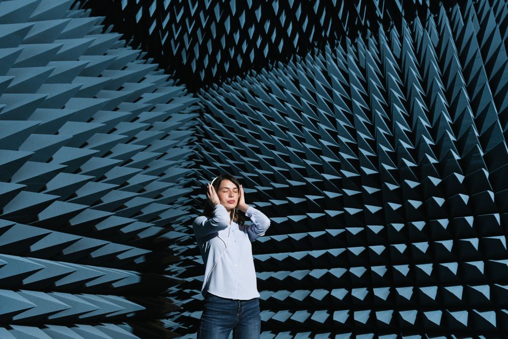 Woman in sound room listening to music