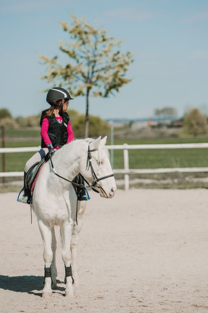 Girl riding horse
