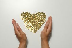 Omega tablets are laid out in the shape of a heart