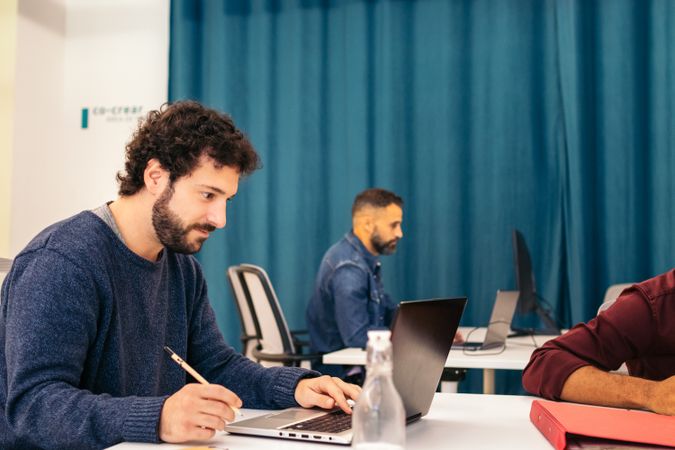 people working with laptop in a coworking