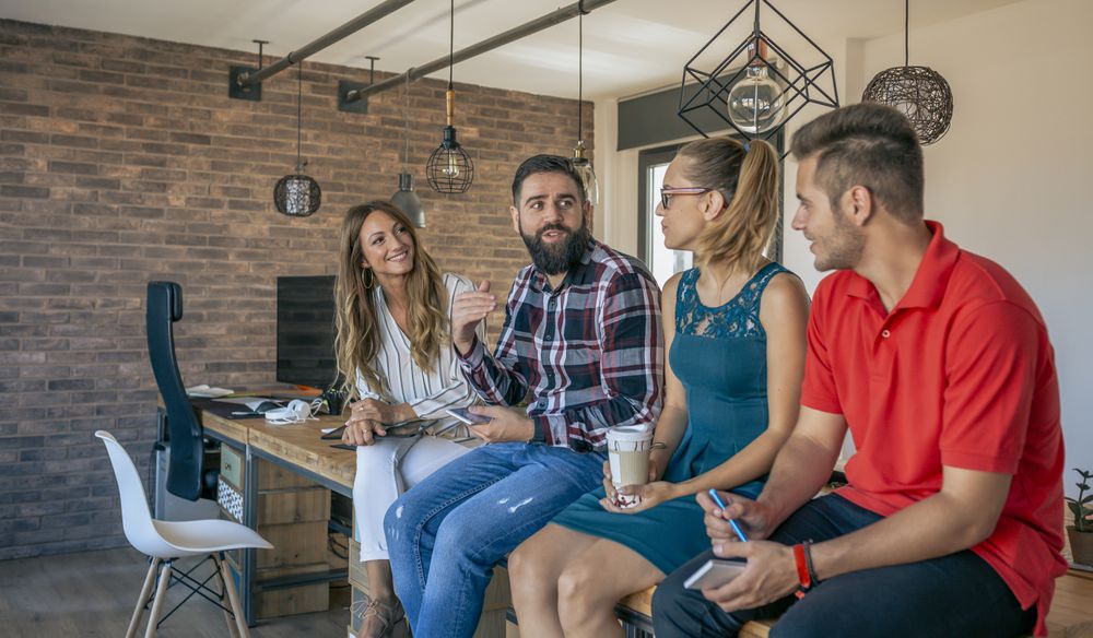 Office workers talking sitting at the table