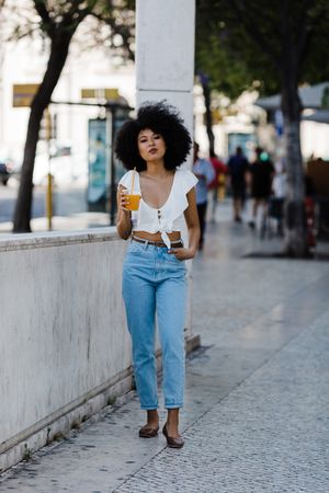 Young female enjoying refreshing drink