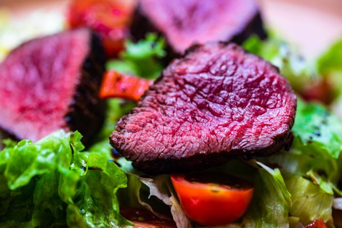 Close up of steak on salad