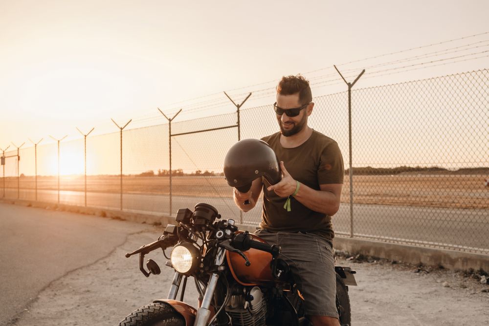 Strong man driving motorcycle