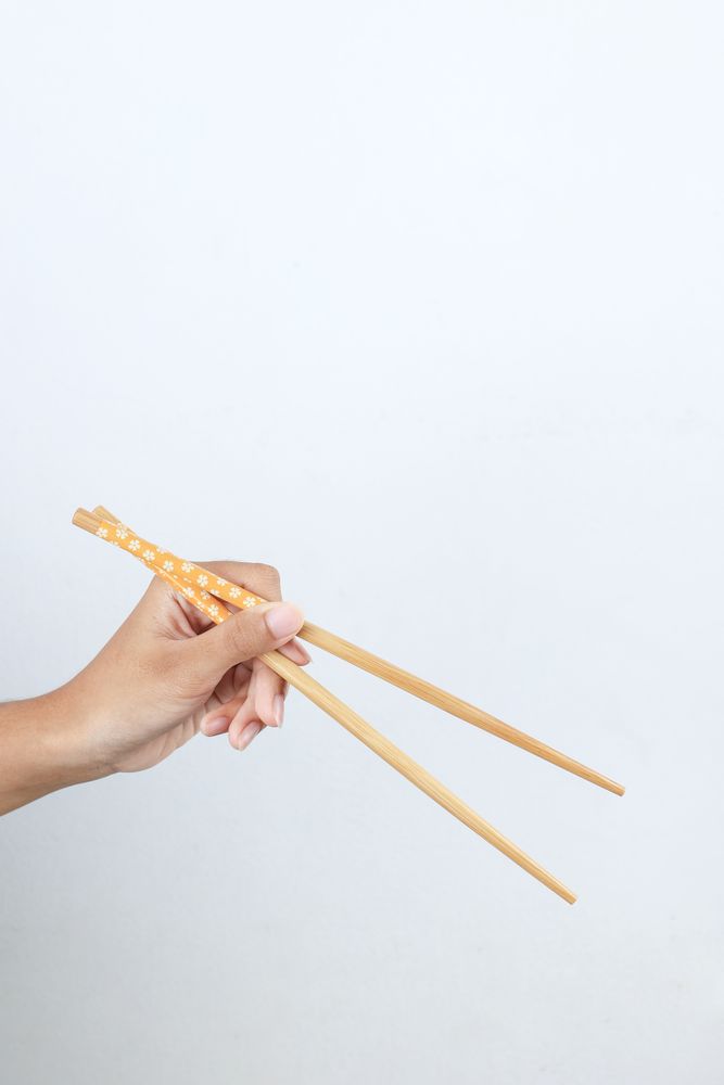 Female Hand Holding Chopstick