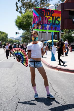 Los Angeles, CA, USA — June 14th, 2020: person standing in street holding protest sign at rally