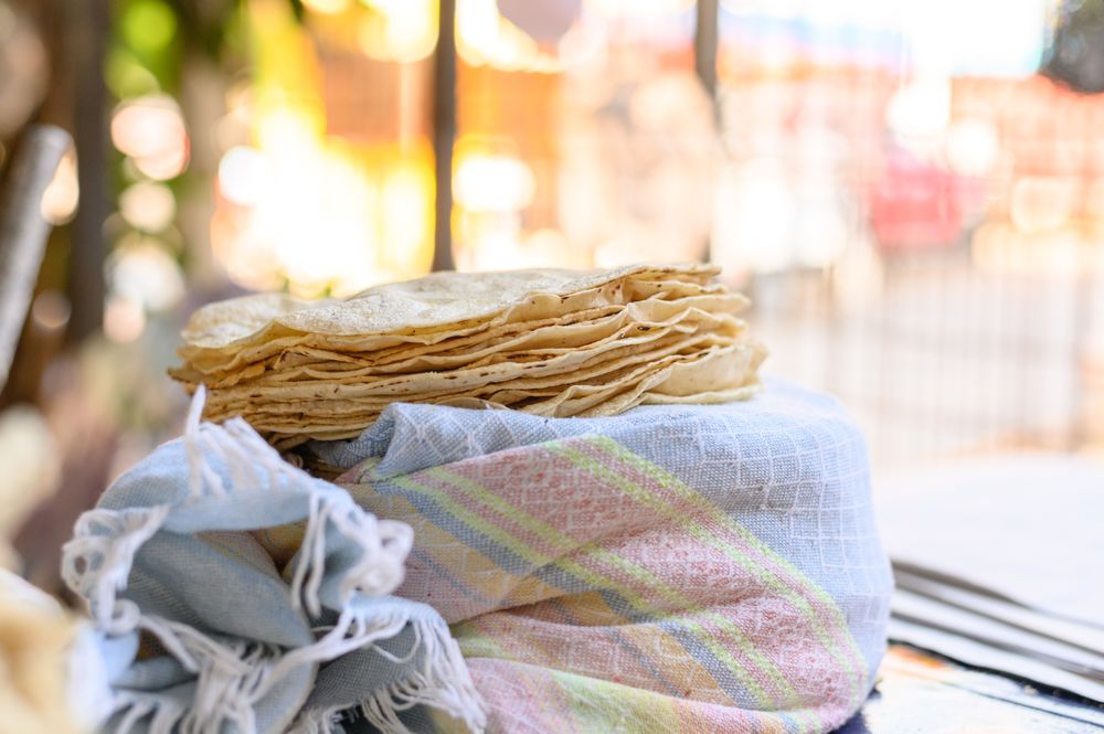 Stack of Mexican flatbreads on wrapped fabric