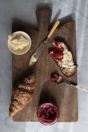 Served breakfast meal with sandwich and jam