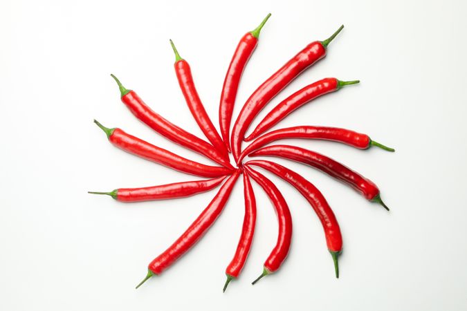 Chilli peppers on plain background, top view