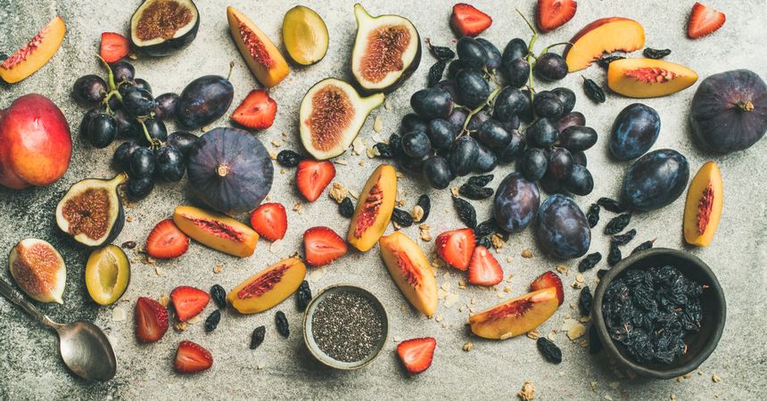 Fruit assortment with figs, grapes, peaches, strawberries, and chia seeds