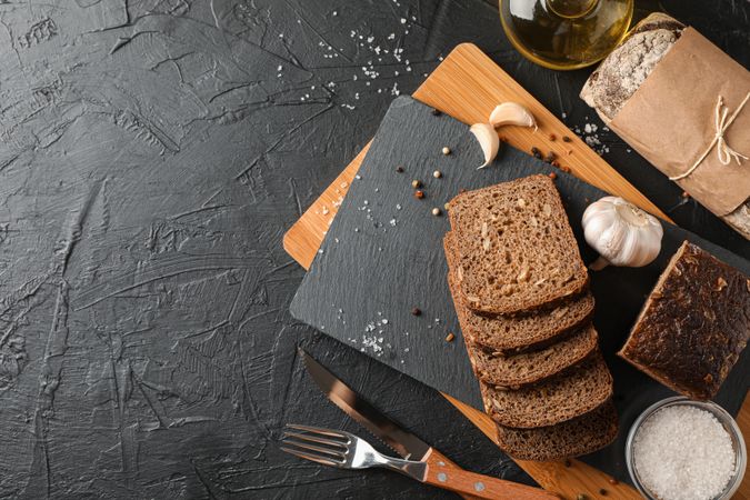 Composition with bread on cutting board, space for text and top view
