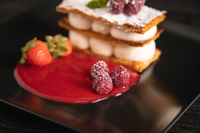 Diphlomate cream and red fruit strudel in elegant plate