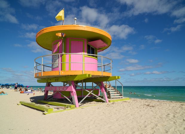 Bright neon-colored round lifeguard tower on Miami Beach