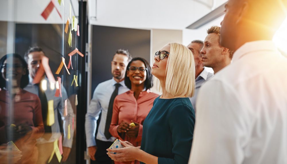 Team of businesspeople brainstorming together in a modern office
