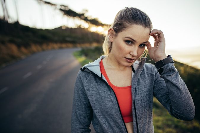 Fitness woman standing on street in the morning