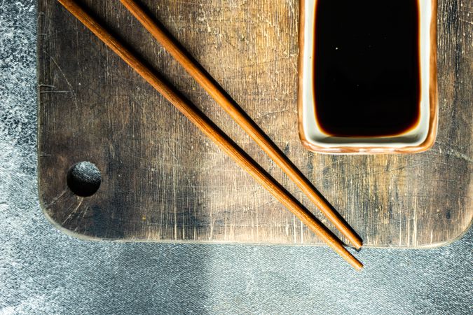 Top view of Asian table setting with chopsticks and soy sauce