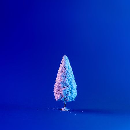 Snowy Christmas tree in vibrant bold gradient holographic colors