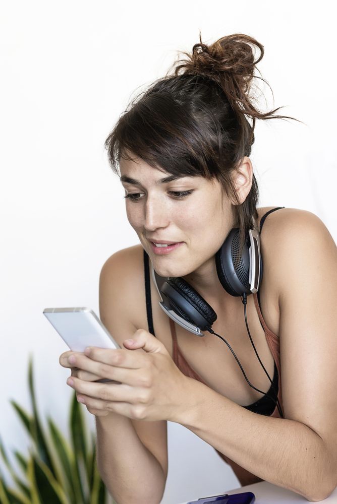 Female smiling with smartphone