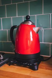 Electric red kettle on counter