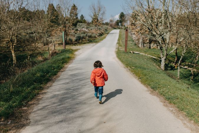 Young girl walking down a path