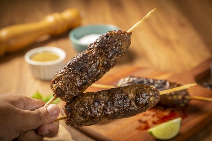 Beef kafta on the wooden board. Kafta, Traditional Arabic cuisine.