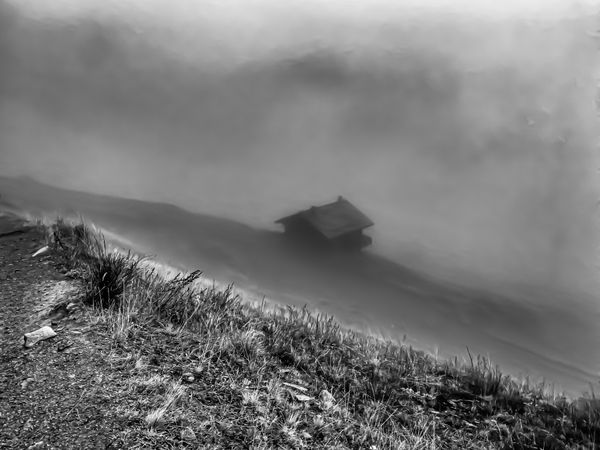Mountain chalet in the fog