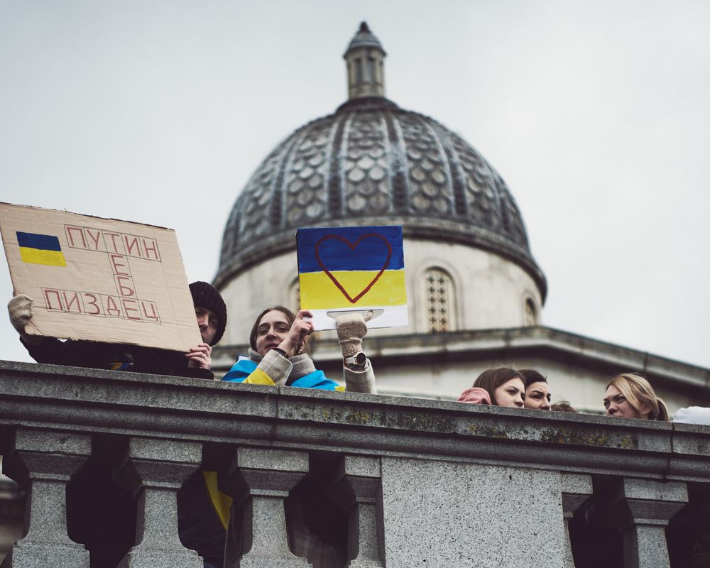 London, England, United Kingdom - March 5 2022: Row of people looking down at protest