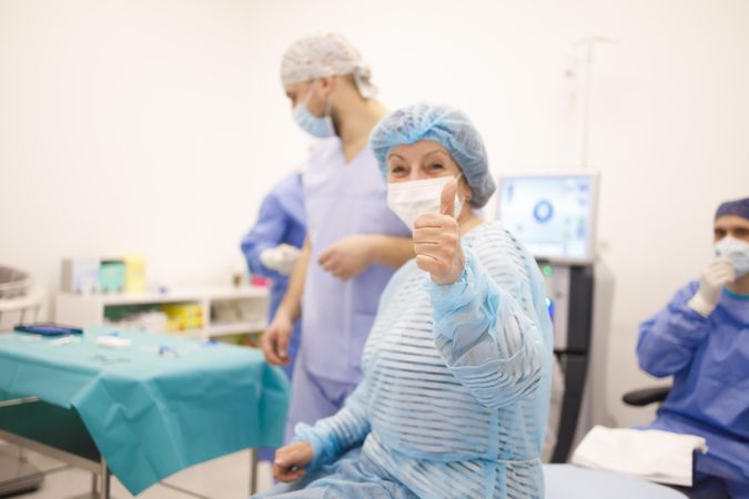 Female patient sitting up before surgery