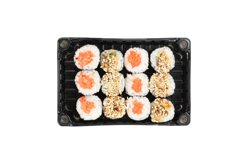 Box with sushi isolated on plain background