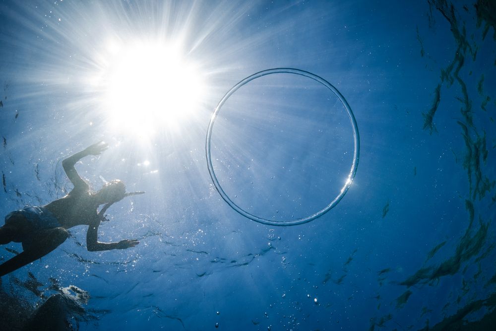 Unrecognizable boy preparing to dive in sea