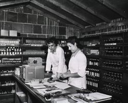 Two female pharmacists in the 1940s