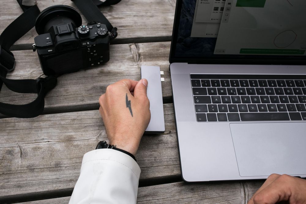 Man transferring data on laptop