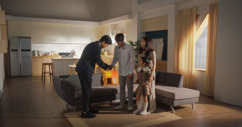 Professional Real Estate Agent Shows Bright New Apartment to a Small Family.