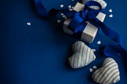 Blue Valentine day concept with felt heart decoration, confetti and gift