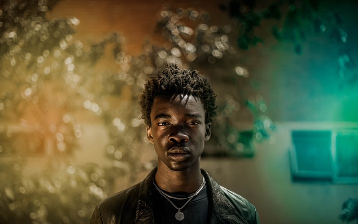 Portrait of African young man in dark leather jacket