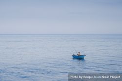 Fisherman in blue boat on sea 56dkzb