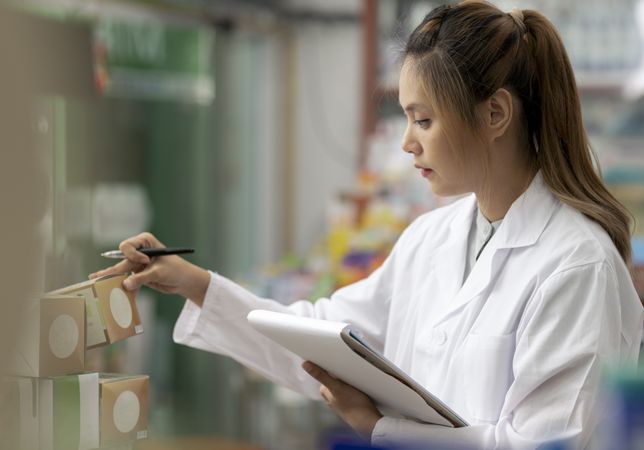 Asian female pharmacist, drug consultant.