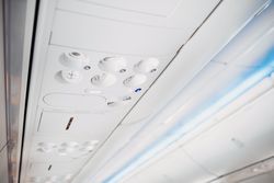 aircraft ceiling compartment with different buttons