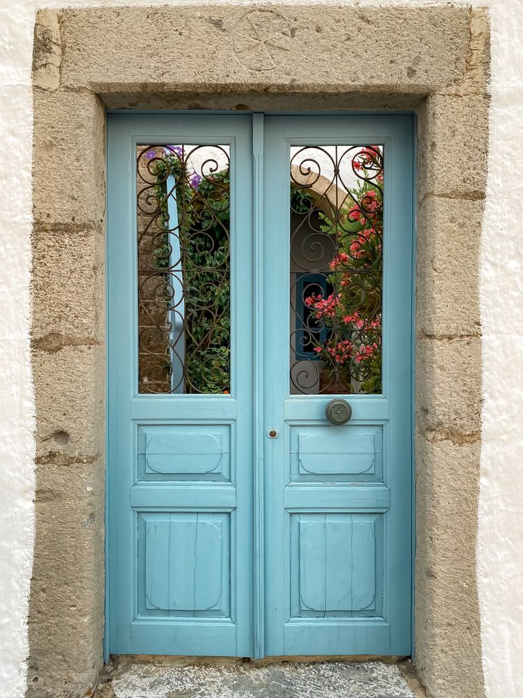 Beautiful blue door with pink flowers