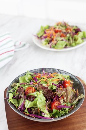 Healthy Vegetable Salad with  Green Purple Lettuce, Cherrry Tomato, Red Cabbage, and Endive.